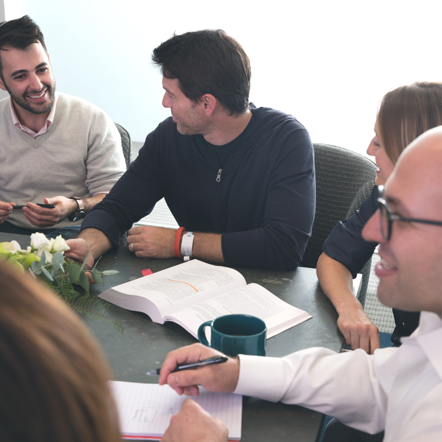 Attorneys meet around a conference table